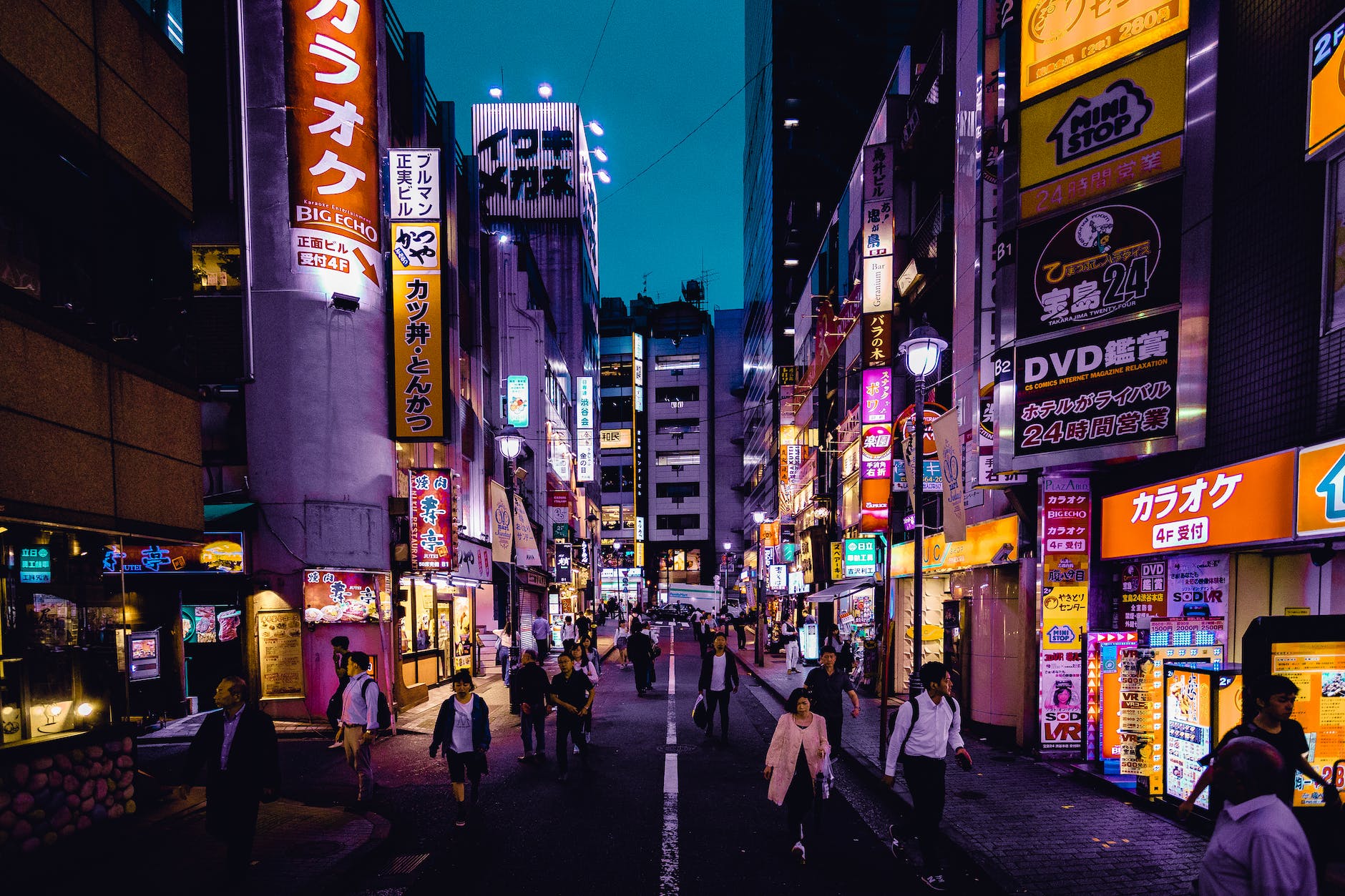 people walking on the streets surrounded by buildings